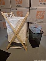 Hamper front with black waste bin and blue basket