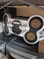 Front view of Aiwa CSD-XM77 boombox on shelf