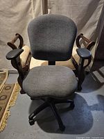 Front view showing full chair, seat, backrest, base with casters