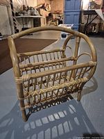 Front angle of wicker magazine rack showing overall structure