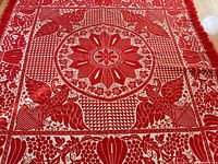 Close central medallion, eagle and border motifs of coverlet