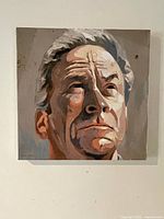 Front view of square oil portrait painting of a man's face