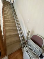 Full view of stair lift rail installed on 14-step staircase