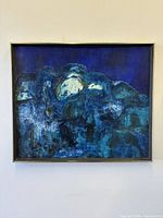 Frontal view of framed blue abstract painting