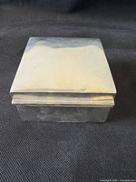 Front view of sterling silver square hinged box