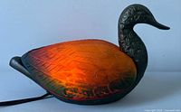 Left profile of illuminated stained glass mallard duck lamp