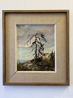 Frontal view of framed painting showing entire artwork and frame