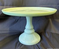 Front angled view of entire jadeite glass pedestal cake stand