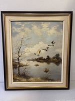 Front view of framed oil painting showing entire artwork and frame