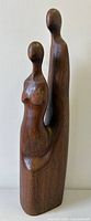 Front view of teak abstract lovers sculpture