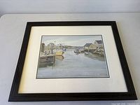 Angled view of entire framed print lying flat