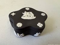 Top view showing star shape and winged couple relief