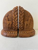 Front view of both Syroco gazelle bookends showing motif and dome form