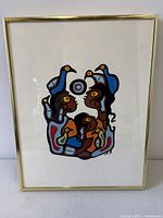 Full view of framed silkscreen print in brass-tone frame