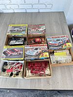 All five NASCAR model kits with boxes and contents displayed