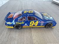 Left side view of 1/18 scale #94 Bill Elliott Mac Tonight NASCAR diecast car