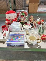 Full lot view with lights, plush Santa, teapot, ornaments, figurines