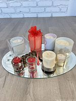 Overview of all candles arranged on mirror tray
