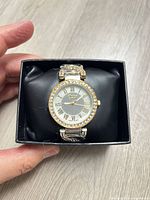 Front view of Geneva watch in case