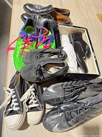 Overview showing all eight pairs of shoes on table