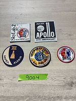 Overview of all five patches laid out on table