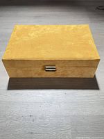 closed tan suede jewelry box