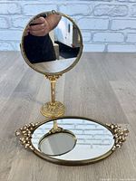 Pedestal vanity mirror and oval tray together