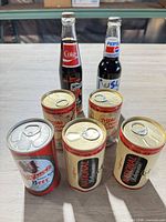 Group shot of all five cans and two bottles