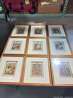 All nine framed prints arranged 3×3 on a table