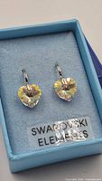 Front view of earrings in box showing crystal hearts