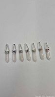 Seven quartz pendants in row showing overall design and quantity