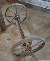 Side view of axle assembly showing both spoked wheels