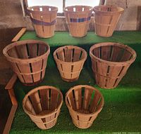 All eight wooden peach baskets grouped