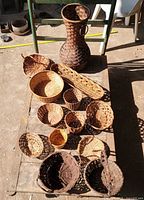 All baskets laid out on table in sunlight