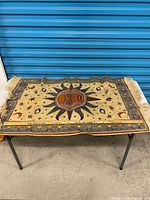 Full view of tapestry throw laid flat on table