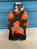 Front view of packaged IceTrax StayON traction cleats