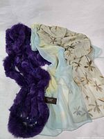 All three scarves side by side on white background
