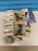 Lot overview showing IKEA BETYDLIG boxes, Classic brackets, Ben-Mor turnbuckle, Stanley pack, misc items