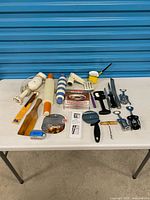 All items laid out on table showing variety of tools