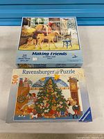 Front view of both sealed 500-piece puzzle boxes