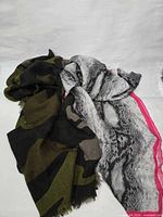 Both scarves spread side-by-side showing full patterns