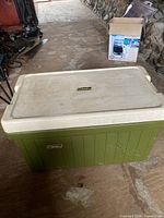 Green Coleman chest cooler with white lid