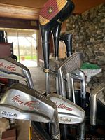 Close-up of Tony Penna irons and persimmon woods in bag