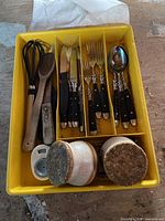 utensils and cutlery set in yellow tray