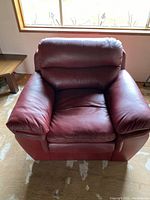 Front view of red leather armchair