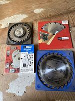 Group view of four Craftsman saw accessories