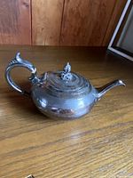 Rounded ribbed teapot shown on tabletop