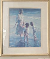 Full view of framed beach scene print with mother and two boys