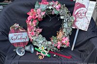 Group overview showing wreath, signs, bells, JOY sign, wreath hanger