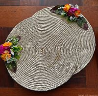 pair of rope straw chargers with flowers